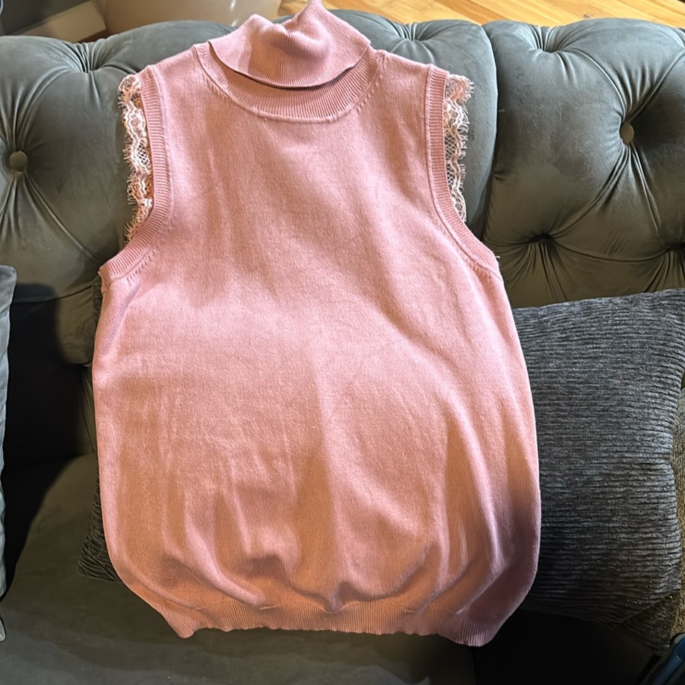 Pink sleeveless turtle neck